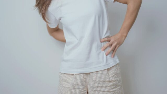 woman having back body ache during at home. adult female with muscle pain due to Piriformis Syndrome, Low Back Pain and Spinal Compression. Office syndrome and medical concept
