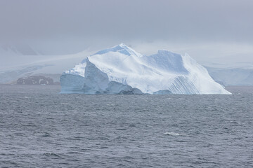 Massive iceberg floating in the De Gerlache Strait which separates the Antarctic Peninsula from the Palmer Archipelago