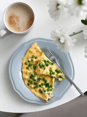 Healthy breakfast omelette or frittata with green peas. Top view