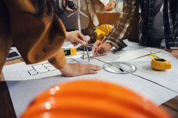 Engineer Teamwork Meeting, Drawing working on blueprint meeting for project working with partner on model building at company office.