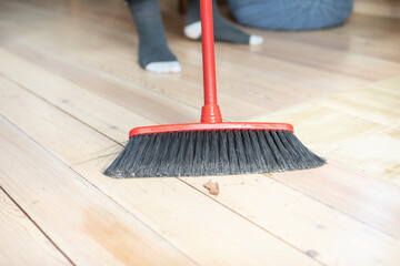 Close-up shot of a broom used to sweep a country house