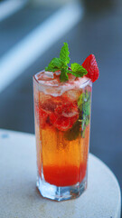 colorful cocktail with strawberry garnish