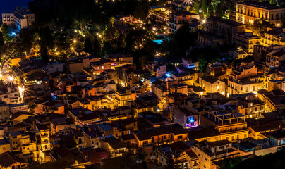 Beautiful view of night town of Italy with colorful golden lights, night landscape on city of Europe