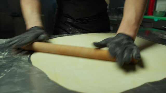 Chef Energetically Rolling Out the Pastry to Make Stuffed Cappellacci Food
