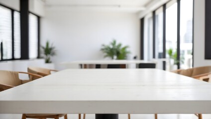 Fototapeta premium empty white wooden table with blurred business office behind