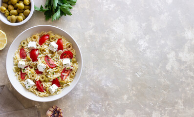 Orzo pasta with white cheese, tomatoes and olives. Healthy eating. Vegetarian food.