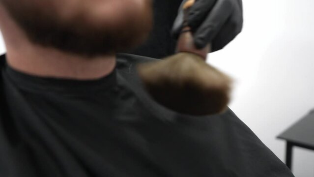 Barber Brushing Off Hair After Cut