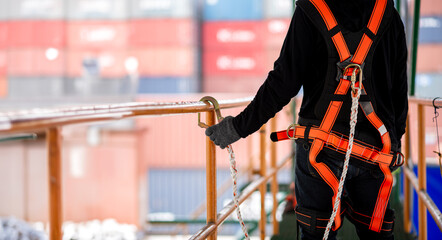 Inspector wear seat belts and protective equipment before working at heights to ensure safety while working. Safety Equipment 