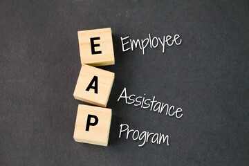 wooden square with the letters EAP or the word Employee Assistance Program