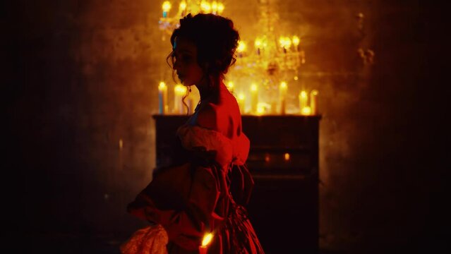 Dark shadow silhouette ghost fantasy lady back rear view gothic beauty woman walks in room black piano candles light. vintage ball gown happy fashion model sexy girl vampire queen halloween red dress