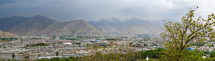 Large panoramic view of Lhasa city, from the Potala Palace on a blue sky background