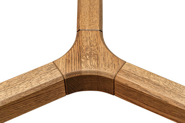 Triple jointed wooden frame of the table is made of solid oak and is stained and lacquered on white background close-up view