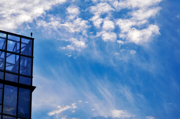 sky and clouds reflected in windows