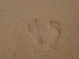 traces de pieds dans le sable
