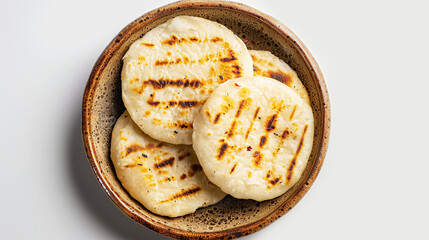 Cornmeal arepas on a plate on light grey background. Traditional flatbread typical for South and Central America countries