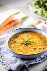 Egg and carrot soup in a bowl. Traditional Slovak egg and carrot soup