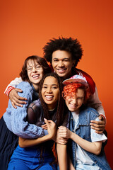 A group of young multicultural friends, including a nonbinary person, in stylish attire, standing together confidently for a picture.