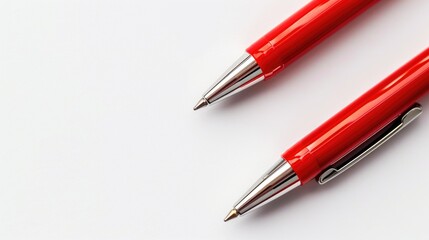 Two red pens on a white background