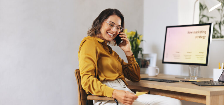 Digital entrepreneur having a marketing project discussion on a phone call