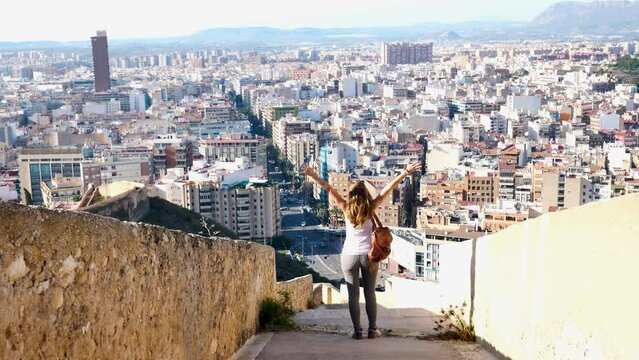woman tourist enjoying panoramic view of Alicante city