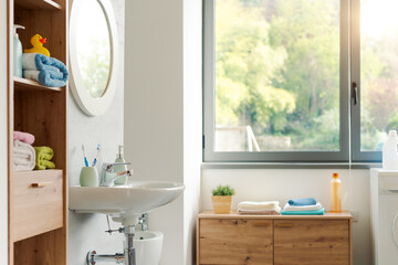 Contemporary clean bathroom interior with window