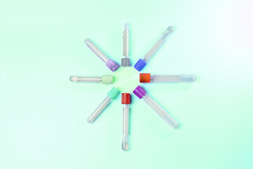 medical tubes and a bottle of analysis blood in a pharmaceutical laboratory blue background copy space