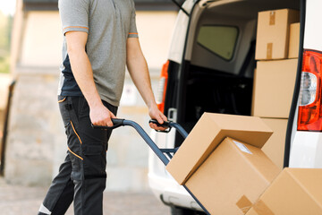Delivery guy pushing a hand truck