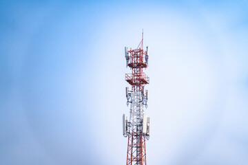 Telecommunications tower, transmitter, wireless communication antenna 5G cellular network, global connectivity In the background, the sky is bright