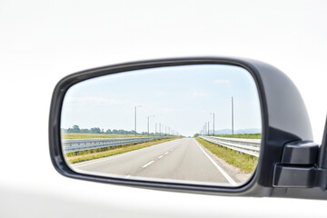 Empty Road in Rearview Mirror
