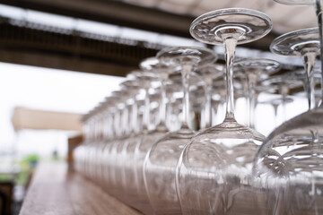 Wine glasses lined up in a row ,Background blurring of light
