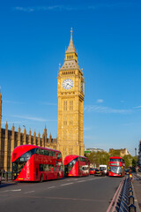 Obraz premium Houses of Parliament with Big Ben and double-decker buses on Westminster bridge, London, UK