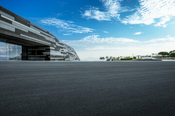 Obraz premium Empty asphalt square road and modern city skyline background