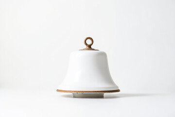 White Bell with Wooden Base on White Background