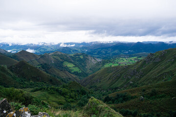 View of the valley covered by clouds on the ascent to Lagos de Covadonga. Asturias, Spain