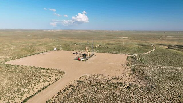 Warking oil well brings petroleum oil hydrocarbons to the surface.
