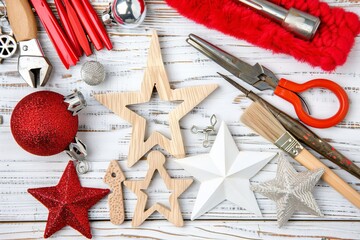 Elf painting toy soldier in santa s workshop  cheerful scene with tools and unfinished toys