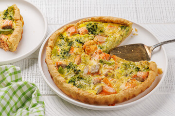 Homemade pie with salmon and broccoli
