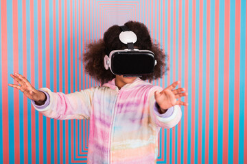 Girl using vr in colorful studio