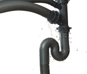 Leaking water from gray plastic pipe under sink. Drain leak water from pipe plumbing in bathroom as...