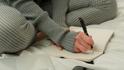 Unrecognizable student girl female lady freelancer woman businesswoman at home bedroom on bed...