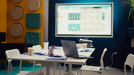 Empty boardroom business office used for staff meetings, global organization working on fintech and economics. Workspace equipped with interactive board for executive briefing discussions. Camera B.