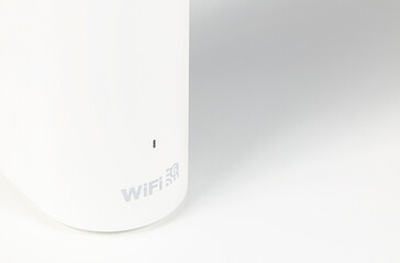Close up dual band wi-fi 6 router on white table.