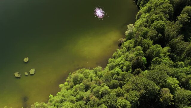 Steinsee bei Munchen Luftaufnahme. Steinsee, See in Bayern Luftbildansicht. Lake Stein aerial view near Munich, Bavaria, Germany. One of warmest lakes in Germany. Steinsee is located in forest area. 