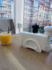 orange juice on the table in a cozy room