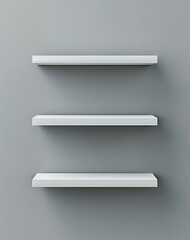 Minimalist white three-level floating shelves on gray wall