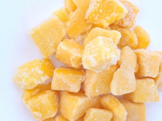 Frozen pile of mango fruit.