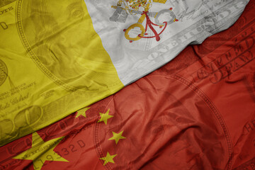 waving colorful flag of vatican city and national flag of china on the dollar money background....