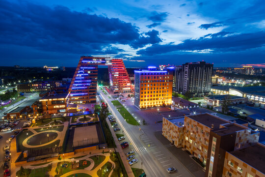 Akademgorodok, Novosibirsk city, Novosibirsk region, Russia. Top view of the street and technopark of Novosibirsk Akademgorodok. Beautiful modern building in the form of an arch over the road. Evening