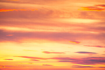 Fototapeta premium Beautiful , luxury soft gradient orange gold clouds and sunlight on the blue sky perfect for the background, take in everning,Twilight, Large size, high definition landscape photo