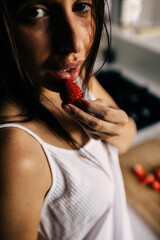 Beautiful woman in the kitchen preparing food. 
